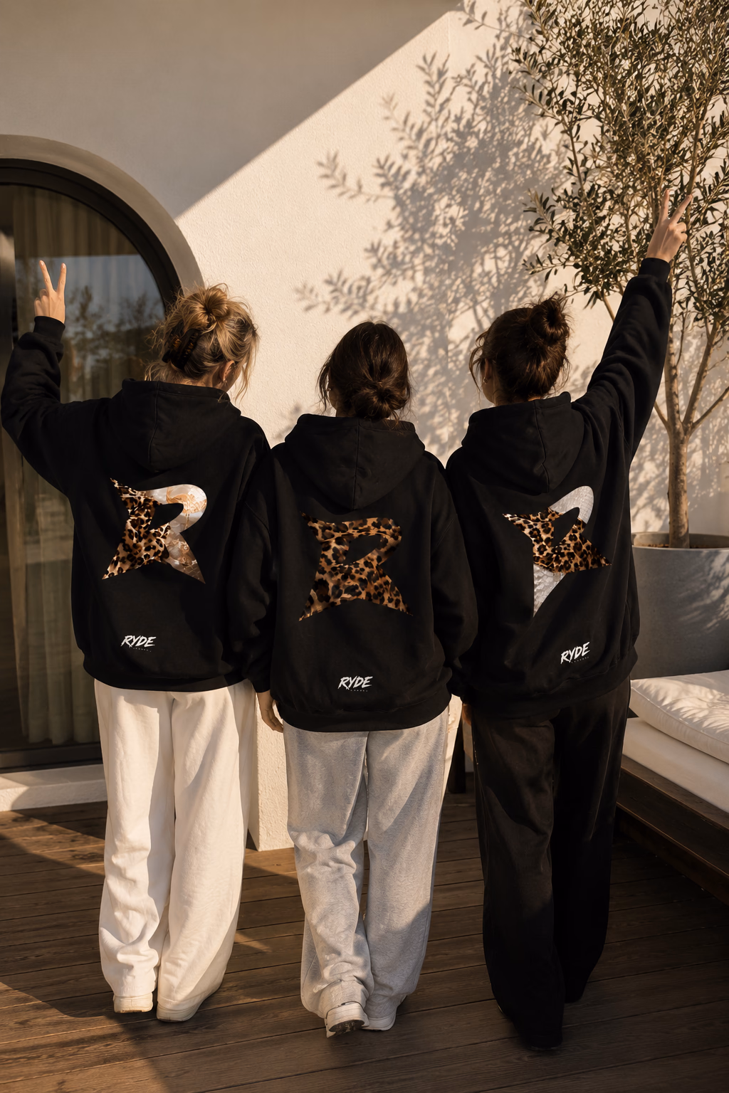 Tres mujeres usando hoodies Ryde Apparel